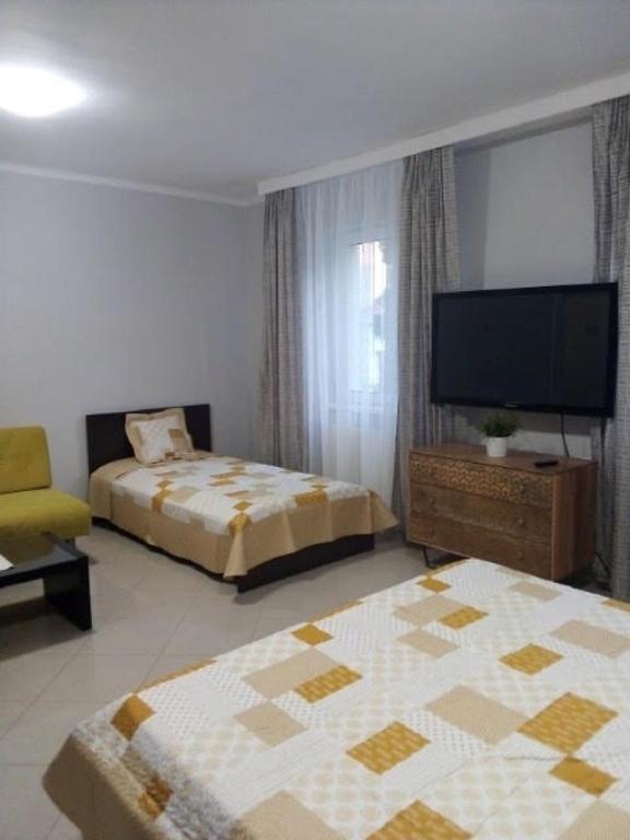 Posteľ alebo postele v izbe v ubytovaní Apartman Ráchegy