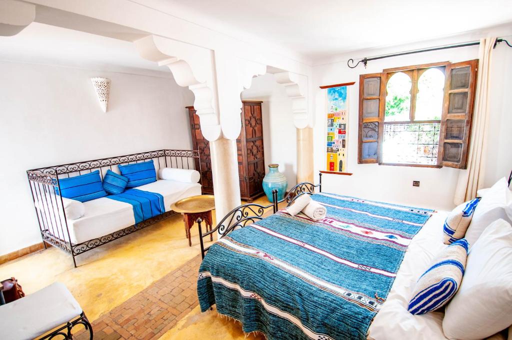 Postel nebo postele na pokoji v ubytování Hotel & Spa Riad Dar El Aila
