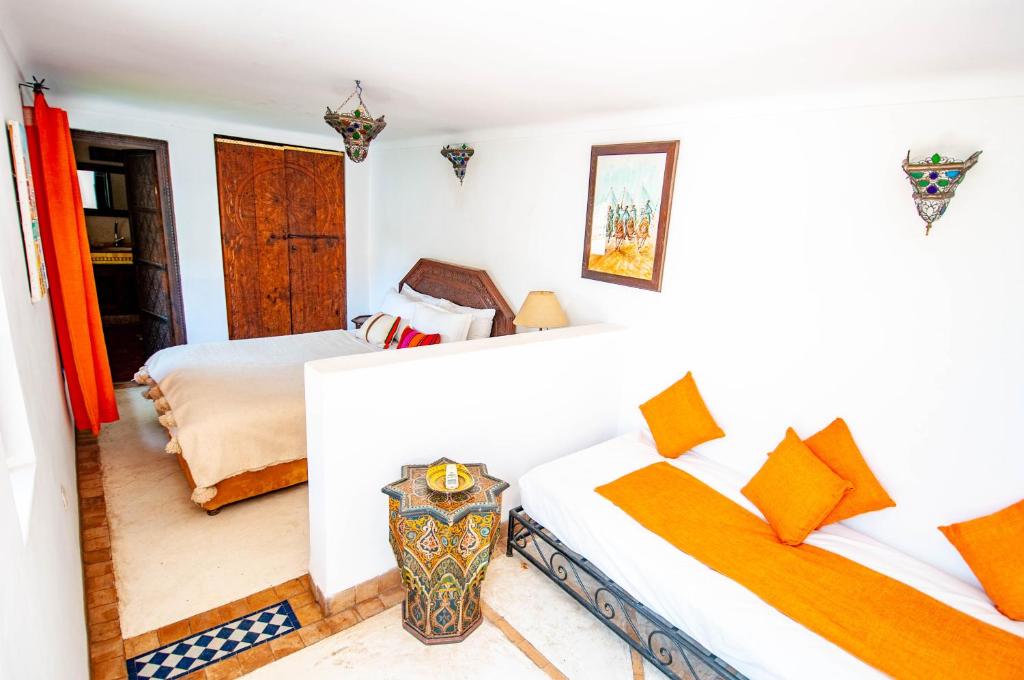 Postel nebo postele na pokoji v ubytování Hotel & Spa Riad Dar El Aila