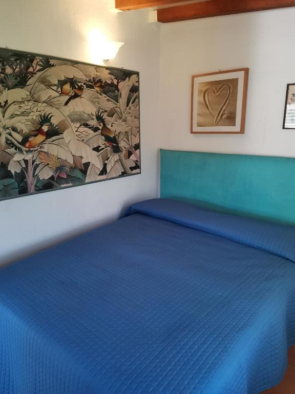 A bed or beds in a room at Giannella Tuscany Holidays