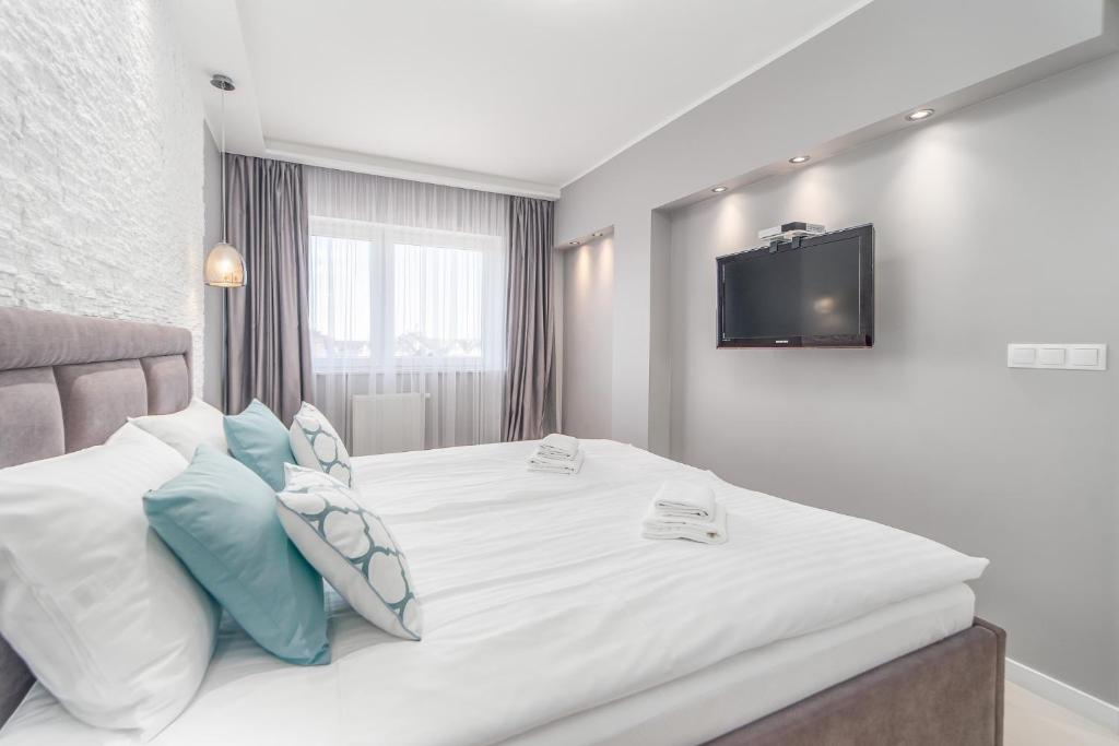 Posteľ alebo postele v izbe v ubytovaní Stylish Vacation Apartment with Parking in Międzyzdroje by Noclegi Renters