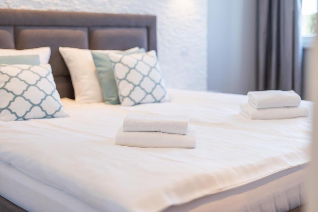 Posteľ alebo postele v izbe v ubytovaní Stylish Vacation Apartment with Parking in Międzyzdroje by Noclegi Renters
