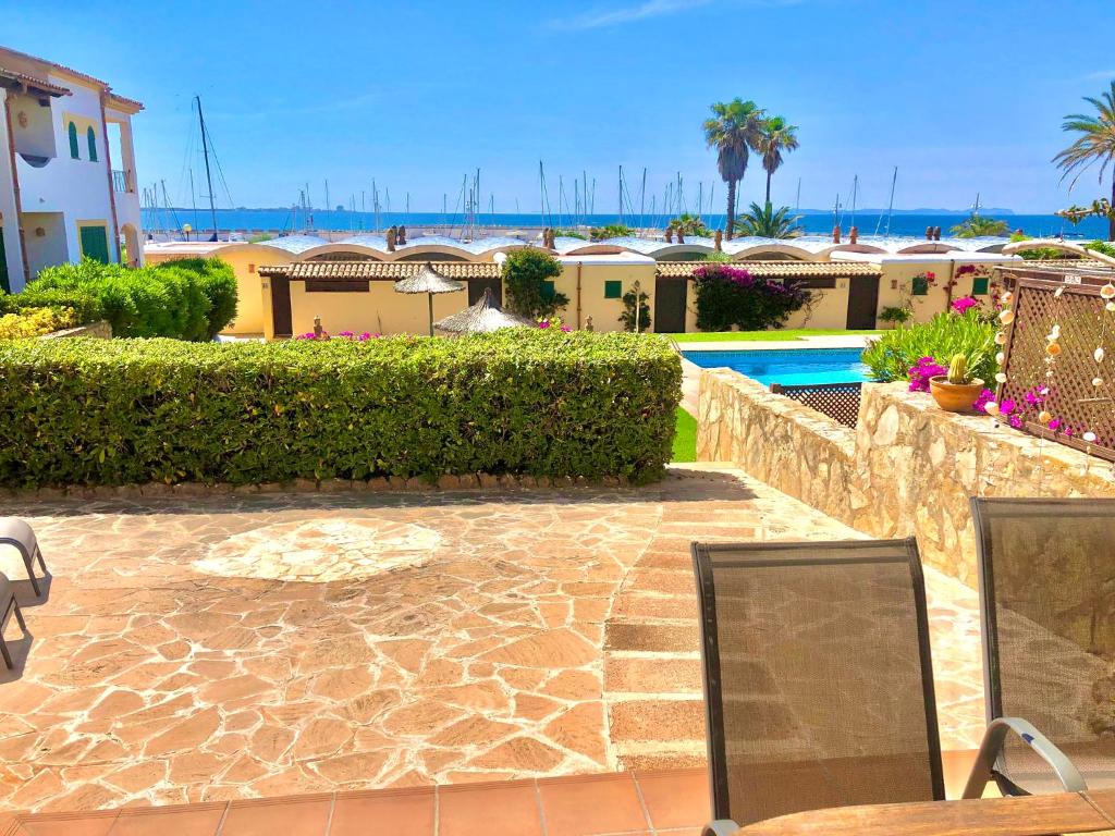 a view of a resort with a pool and buildings at Balco d’es Trenc in Sa Ràpita