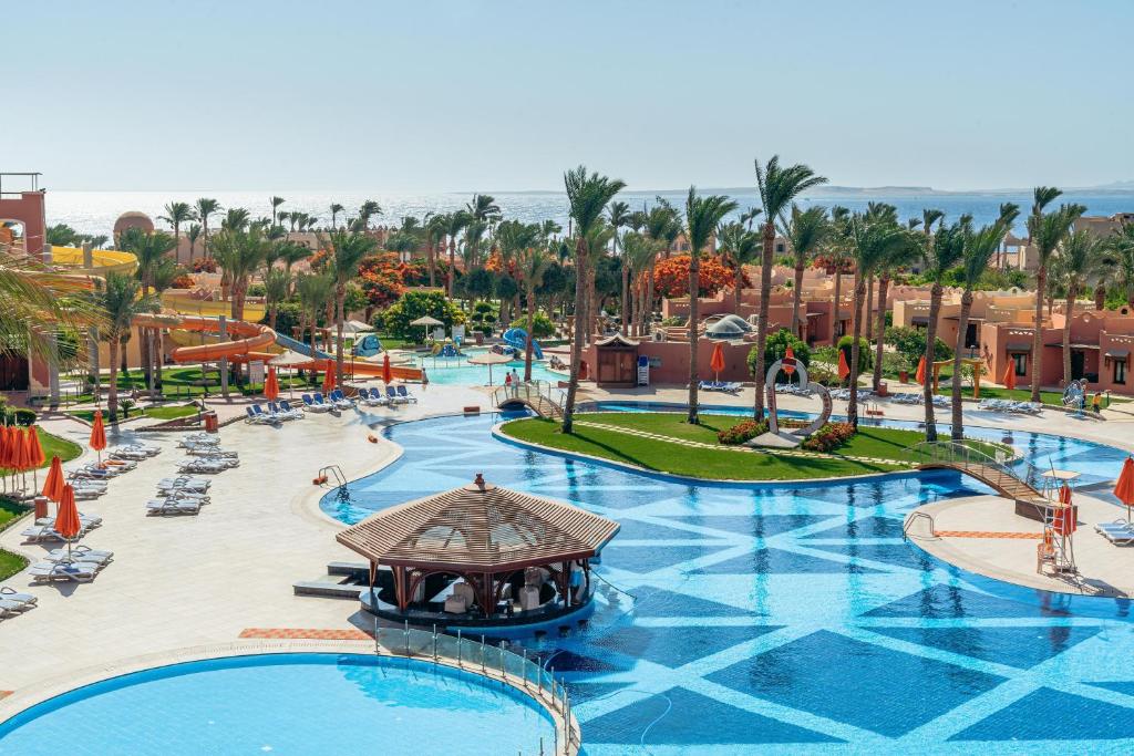 an overhead view of a resort pool with palm trees at Nubian Village, Families and Couples only in Sharm El Sheikh