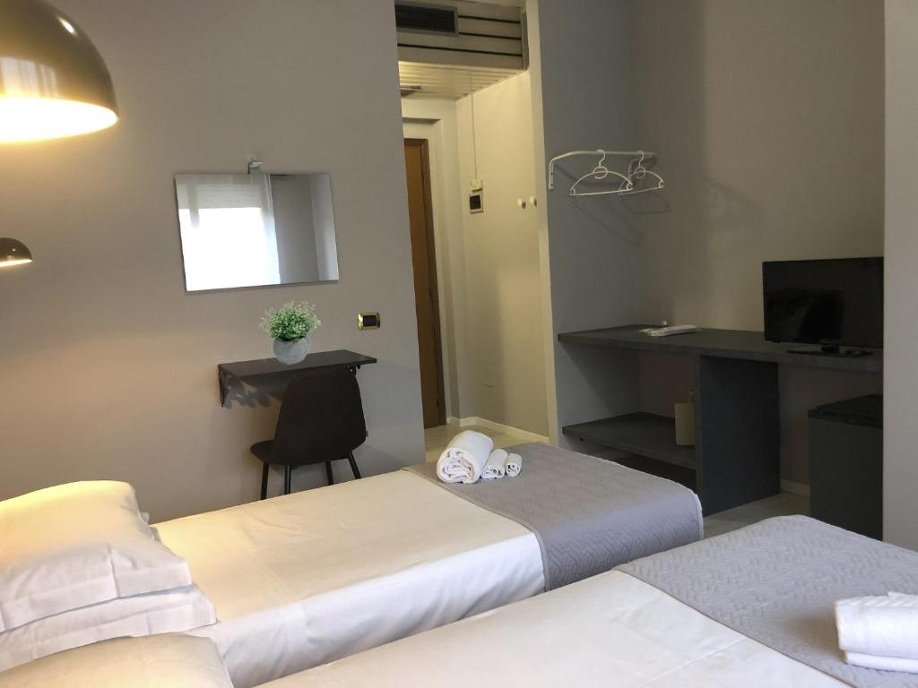 Posteľ alebo postele v izbe v ubytovaní Hp Fly Hotel Bologna