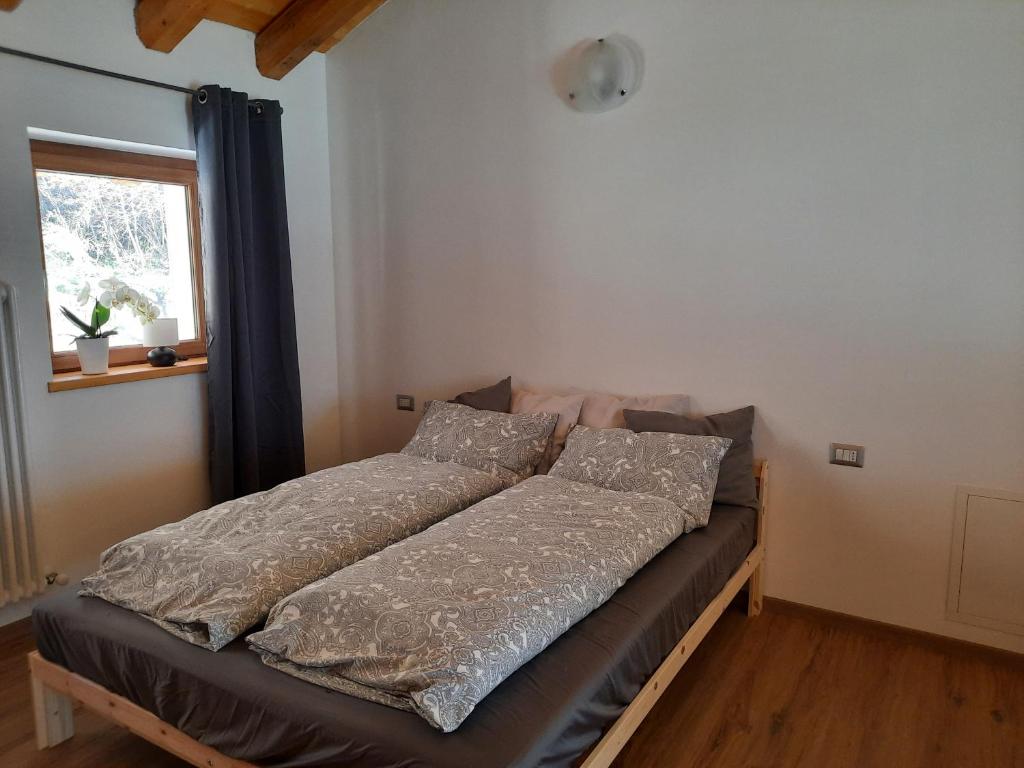 Postel nebo postele na pokoji v ubytování Ai Monti