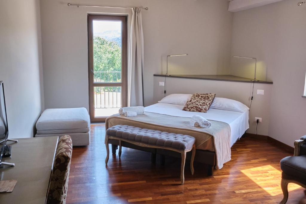 Postel nebo postele na pokoji v ubytování Tenuta EDONE' Country House