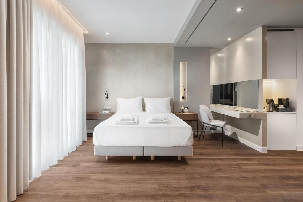 Postel nebo postele na pokoji v ubytování Ivis 4 Boutique Hotel