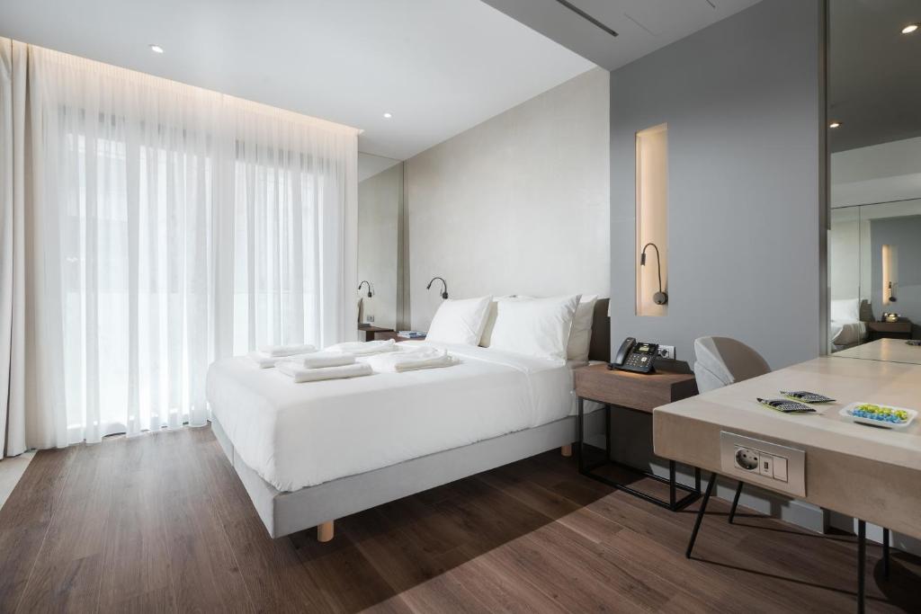 Postel nebo postele na pokoji v ubytování Ivis 4 Boutique Hotel