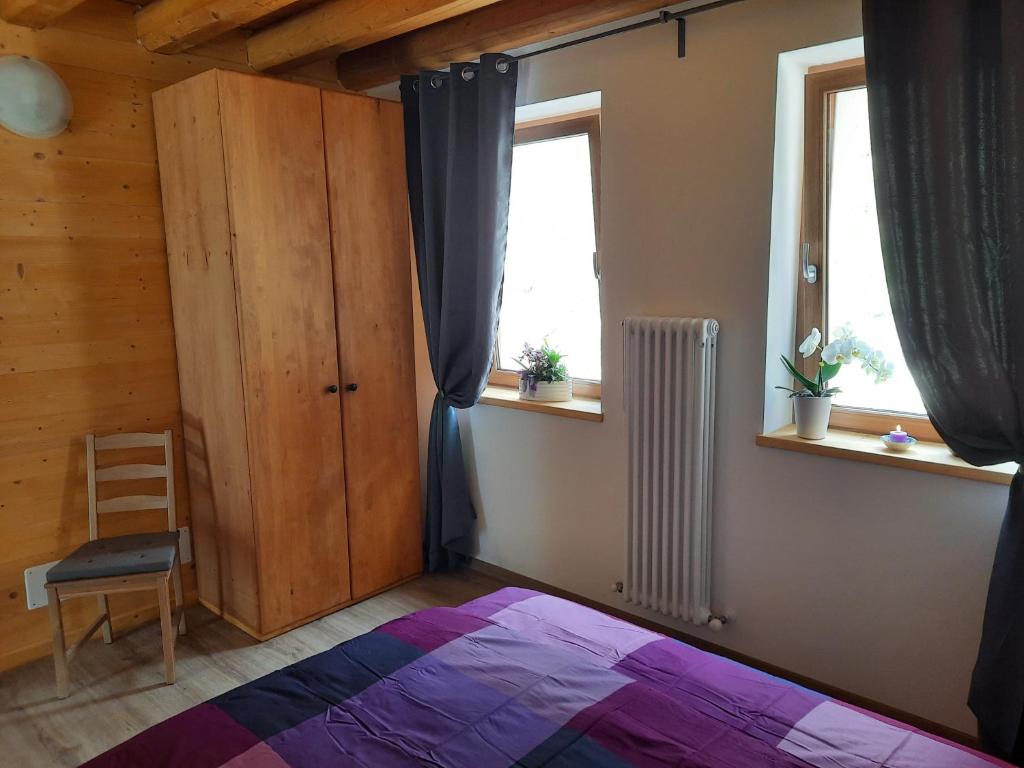 Postel nebo postele na pokoji v ubytování Ai Monti