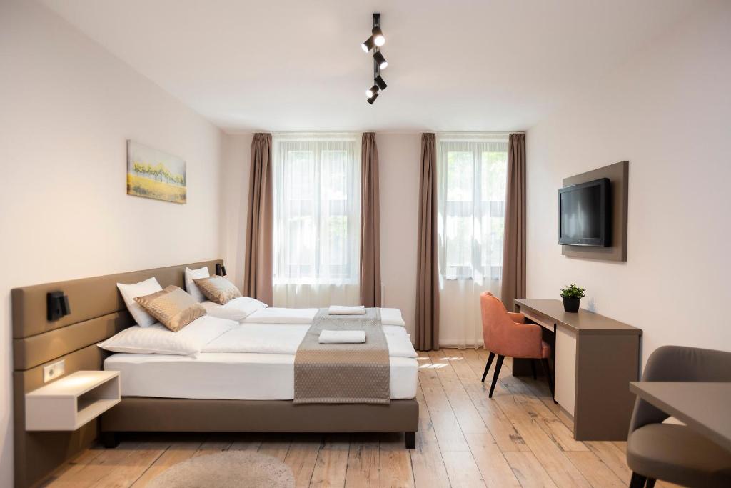 Postel nebo postele na pokoji v ubytování Végvár Spa Apartman