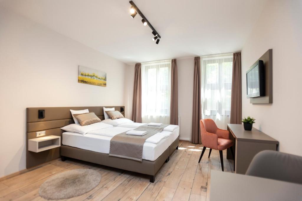 Postel nebo postele na pokoji v ubytování Végvár Spa Apartman