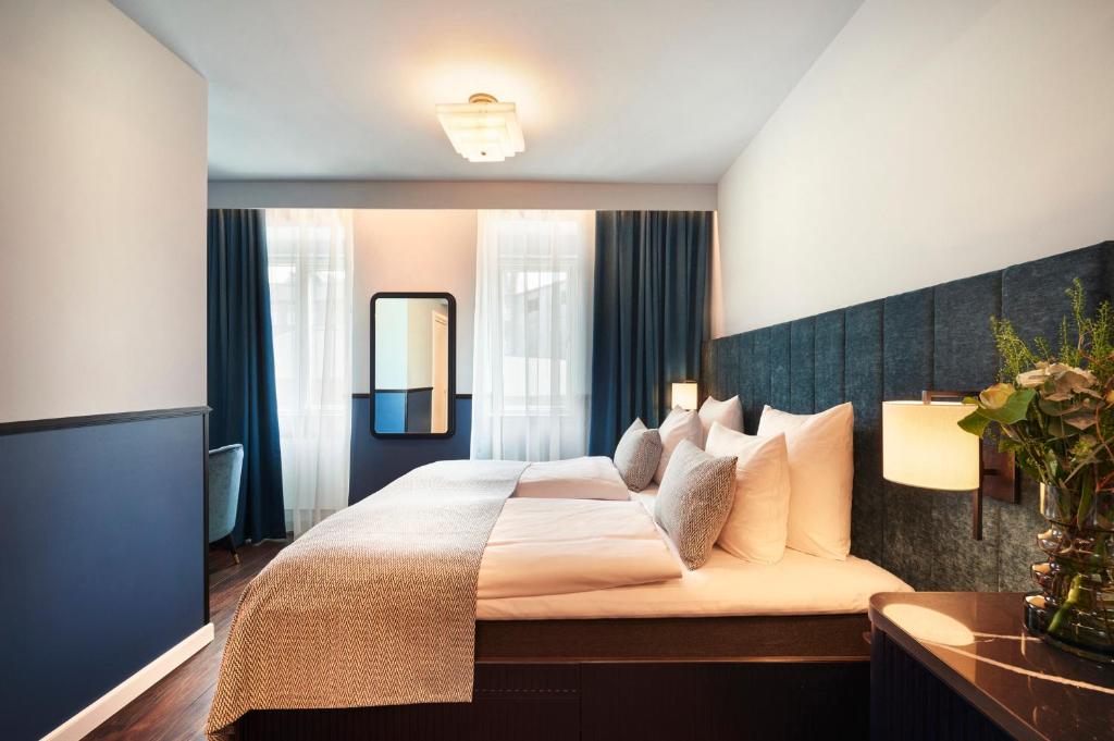 Postel nebo postele na pokoji v ubytování WIDE Hotel