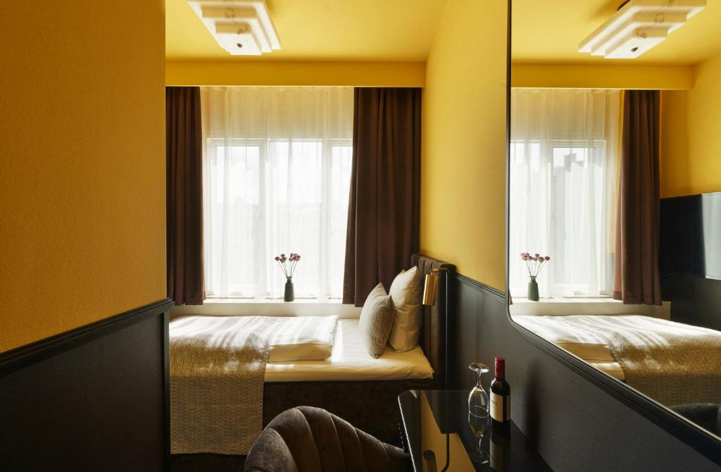 Postel nebo postele na pokoji v ubytování WIDE Hotel