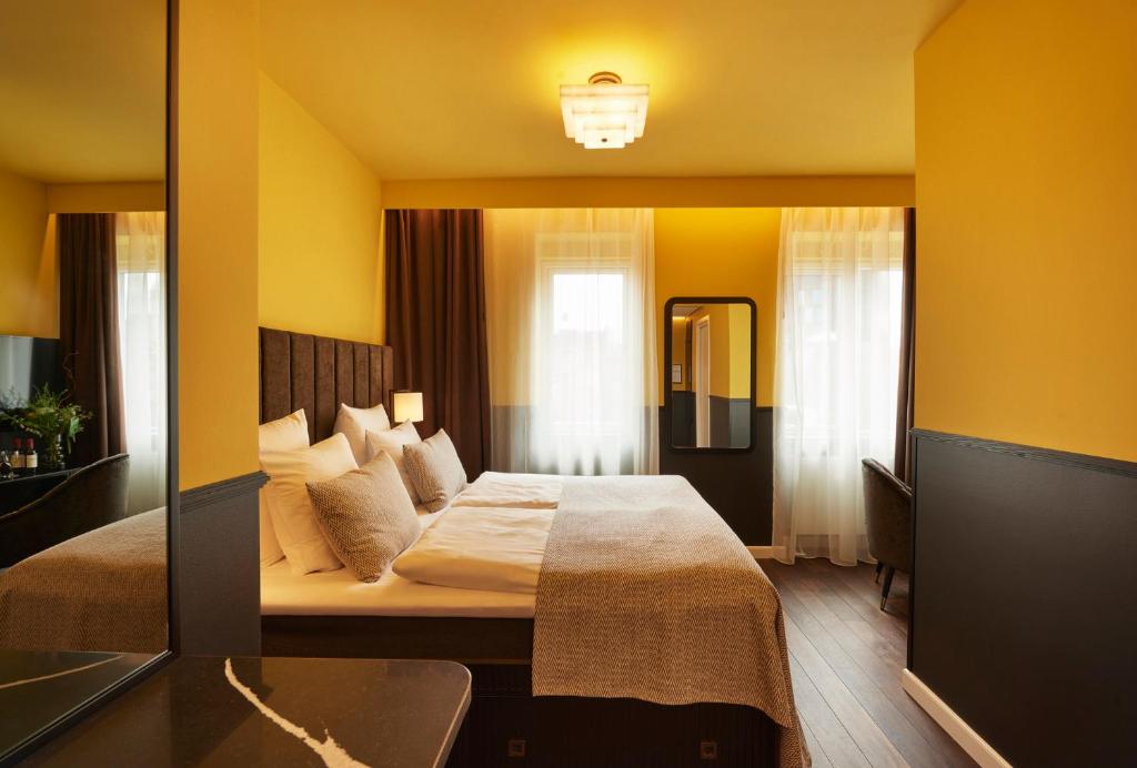 Postel nebo postele na pokoji v ubytování WIDE Hotel