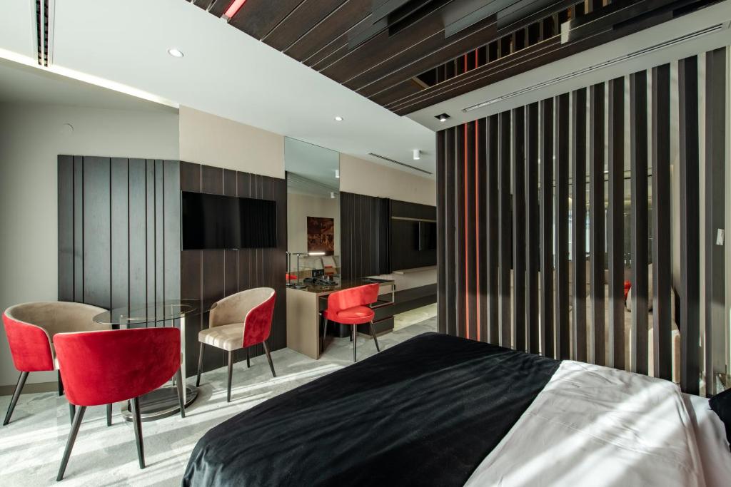 Postel nebo postele na pokoji v ubytování Hotel Ženeva Lux