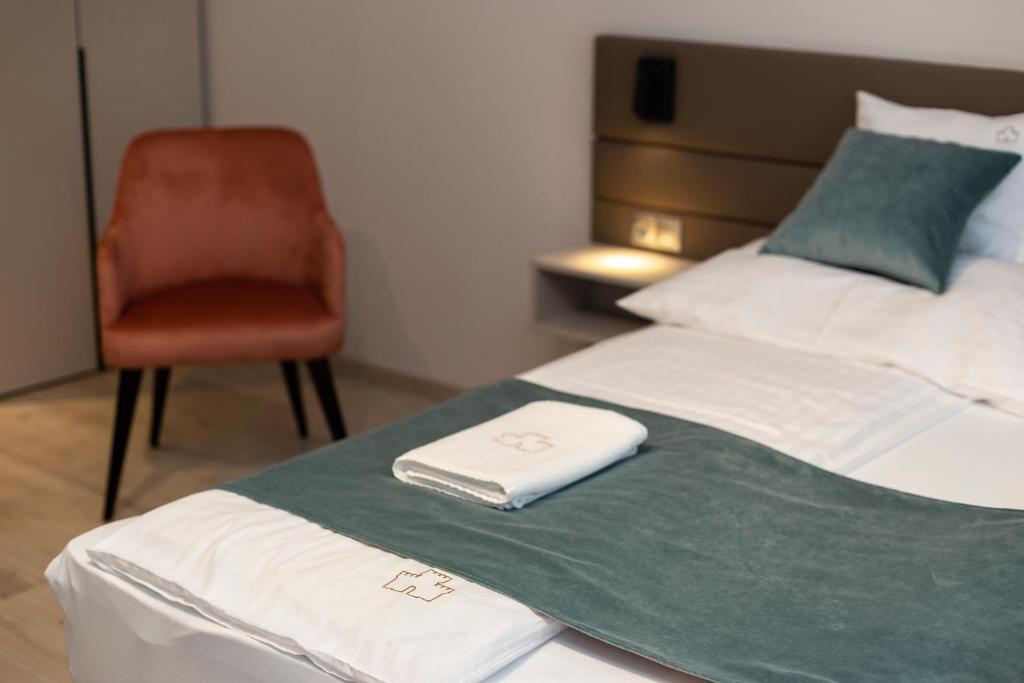 Postel nebo postele na pokoji v ubytování Végvár Spa Apartman