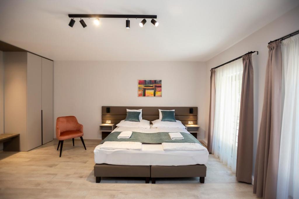 Postel nebo postele na pokoji v ubytování Végvár Spa Apartman