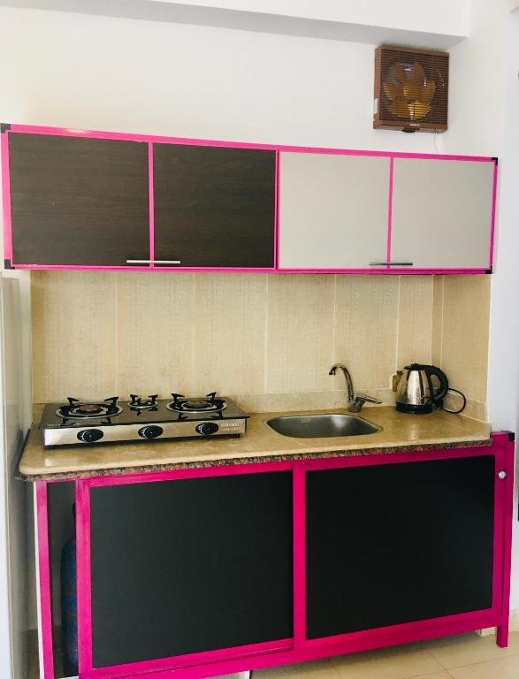 a kitchen with a stove and a sink at Villa 22 in Dahab