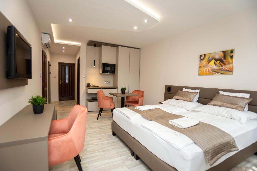 Postel nebo postele na pokoji v ubytování Végvár Spa Apartman