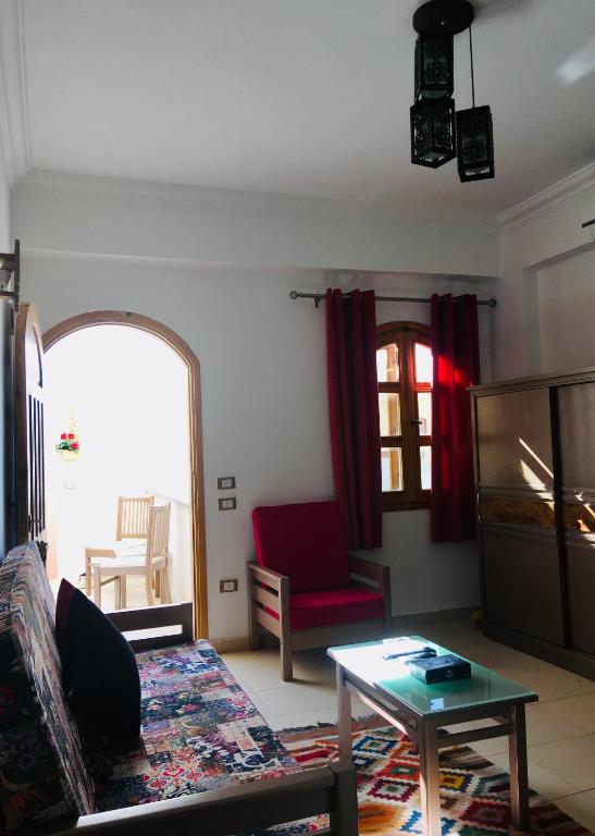 a living room with a couch and a table at Villa 22 in Dahab