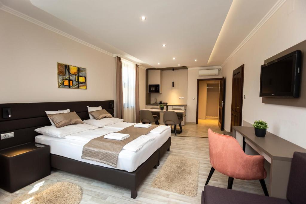 Postel nebo postele na pokoji v ubytování Végvár Spa Apartman