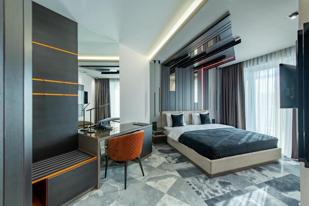 Postel nebo postele na pokoji v ubytování Hotel Ženeva Lux