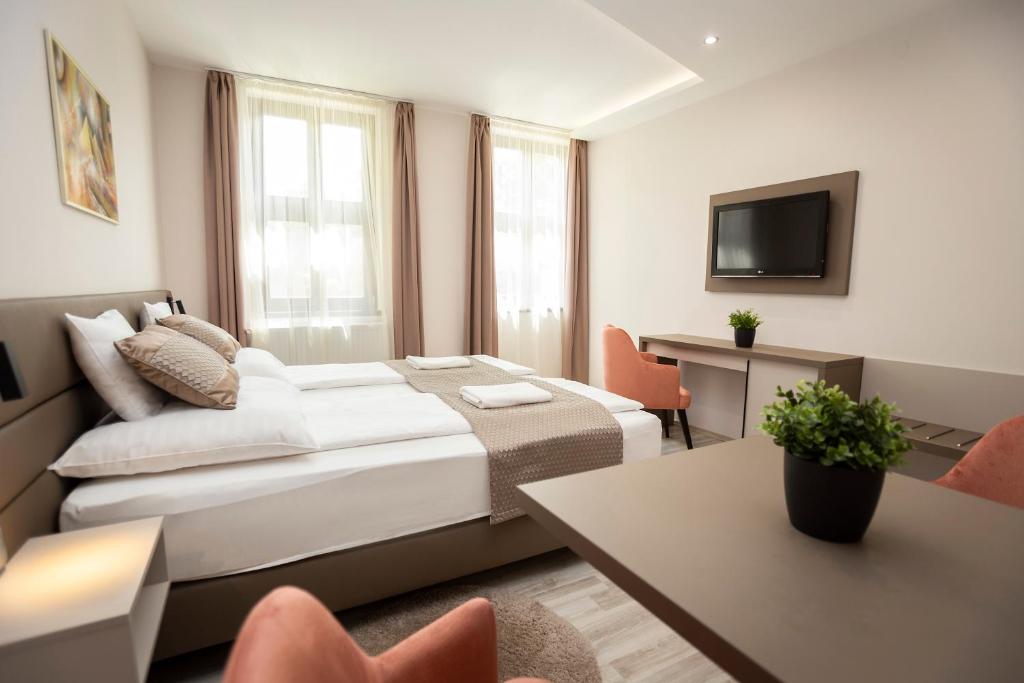 Postel nebo postele na pokoji v ubytování Végvár Spa Apartman