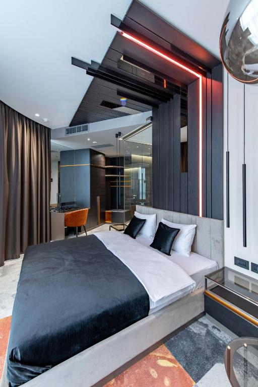 Postel nebo postele na pokoji v ubytování Hotel Ženeva Lux