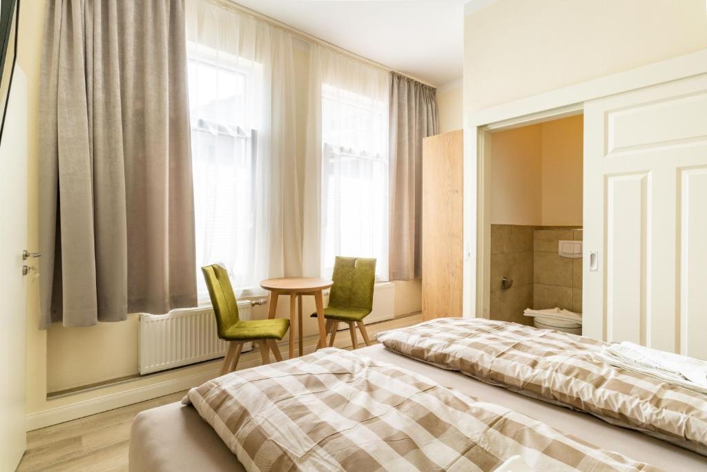 Postel nebo postele na pokoji v ubytování Haus Emma