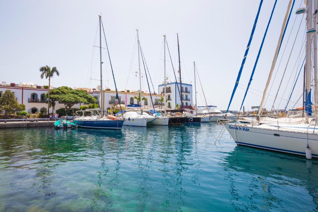 a group of boats docked in a marina at Hotel LIVVO Puerto de Mogán in Puerto de Mogán