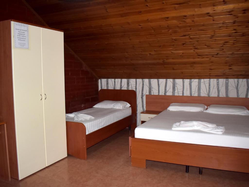Postel nebo postele na pokoji v ubytování Hotel Central