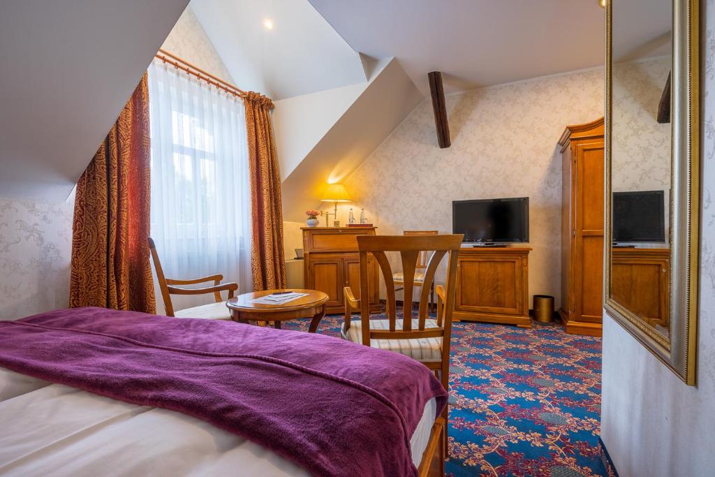 TV a/nebo společenská místnost v ubytování Boutiquehotel Schloßpalais