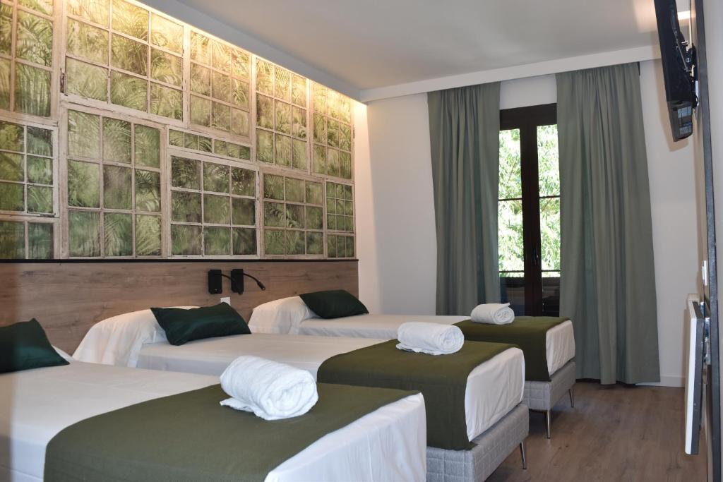 Postel nebo postele na pokoji v ubytování Casp Green House