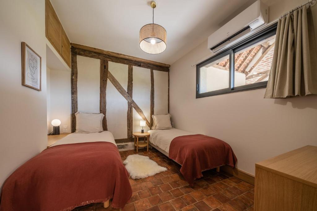 Postel nebo postele na pokoji v ubytování La Grange De Léonie, Chambres d'hôtes avec Piscine et Spa