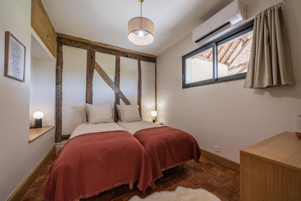 Postel nebo postele na pokoji v ubytování La Grange De Léonie, Chambres d'hôtes avec Piscine et Spa