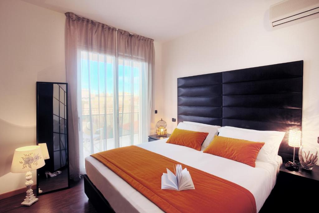 Postel nebo postele na pokoji v ubytování D-Place Hotel & Suite