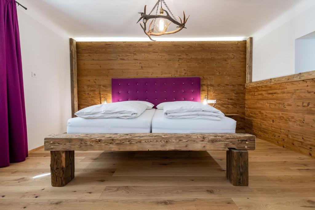 Posteľ alebo postele v izbe v ubytovaní SportRedia Appartements