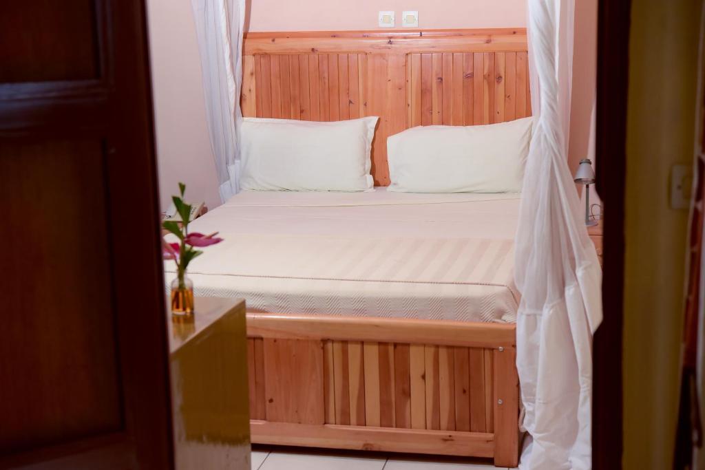 Postel nebo postele na pokoji v ubytování Botanika Hotel