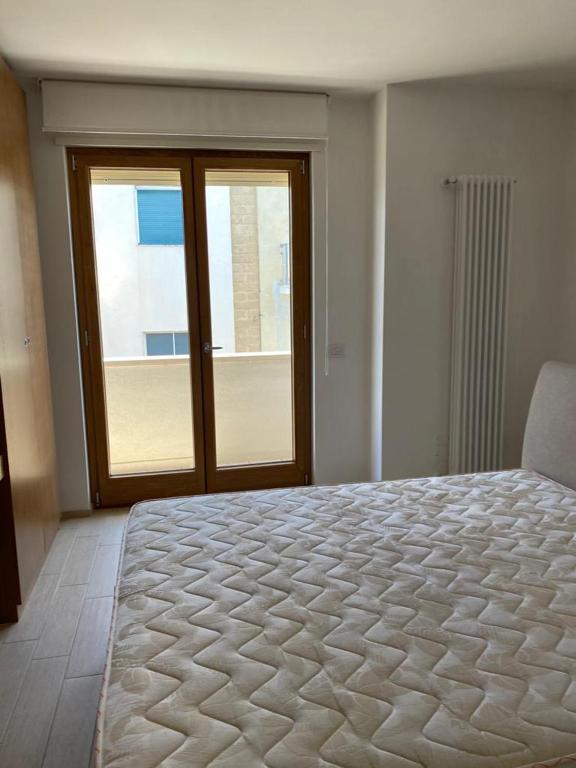 Postel nebo postele na pokoji v ubytování New Suite Lecce