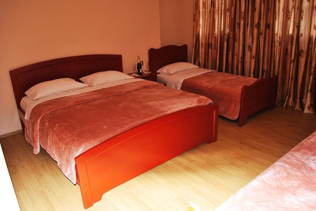 Postel nebo postele na pokoji v ubytování HOTEL RESTORANT VIKTORIA