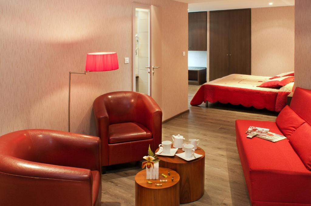 Postel nebo postele na pokoji v ubytování Hotel Restaurant Au Riesling