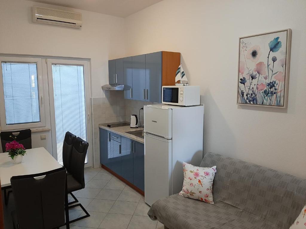 Kuchyň nebo kuchyňský kout v ubytování Apartment Valentina