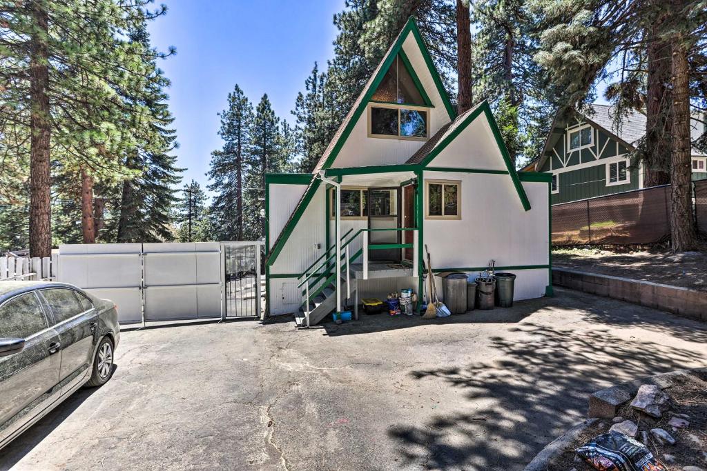 a house with a car parked in front of it at Running Springs A-Frame with Deck and Mtn Views! in Running Springs