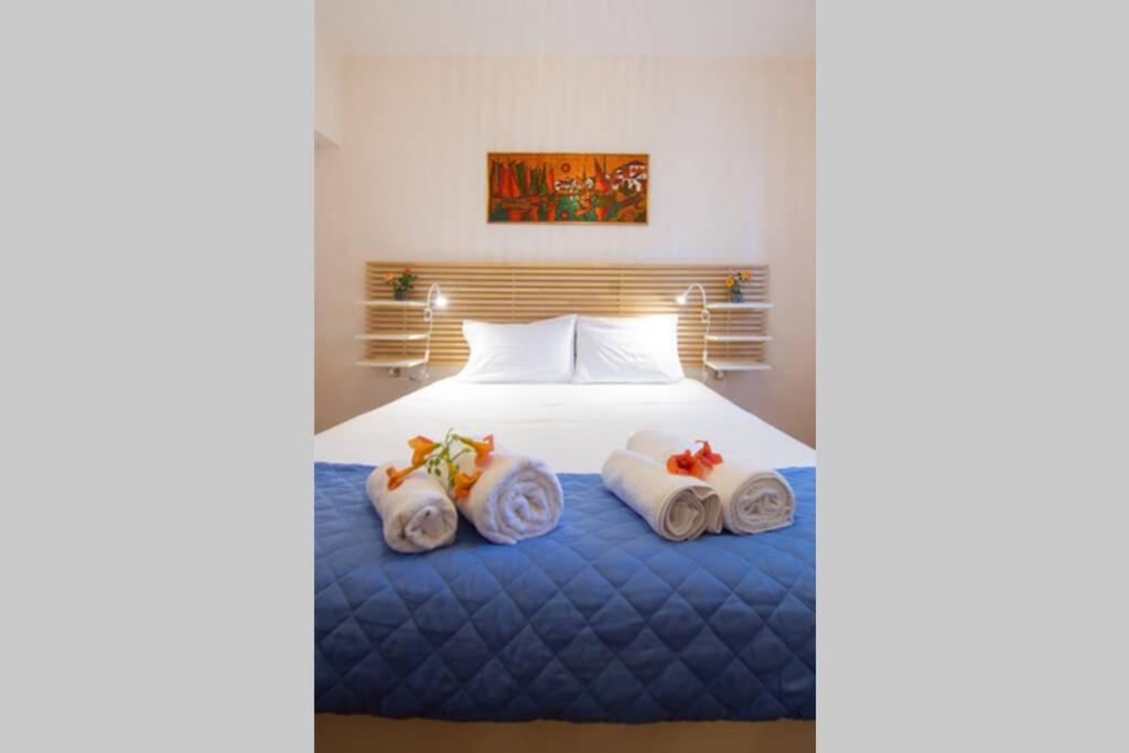 Postel nebo postele na pokoji v ubytování Natsios Thanasakis Apartment