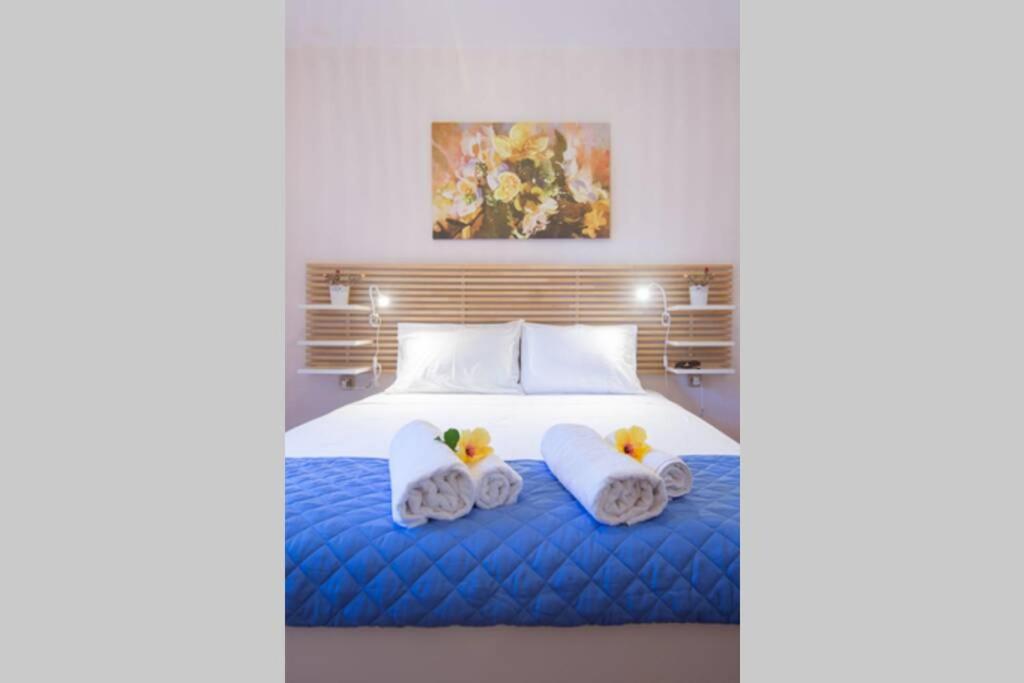 Postel nebo postele na pokoji v ubytování Natsios Thanasakis Apartment