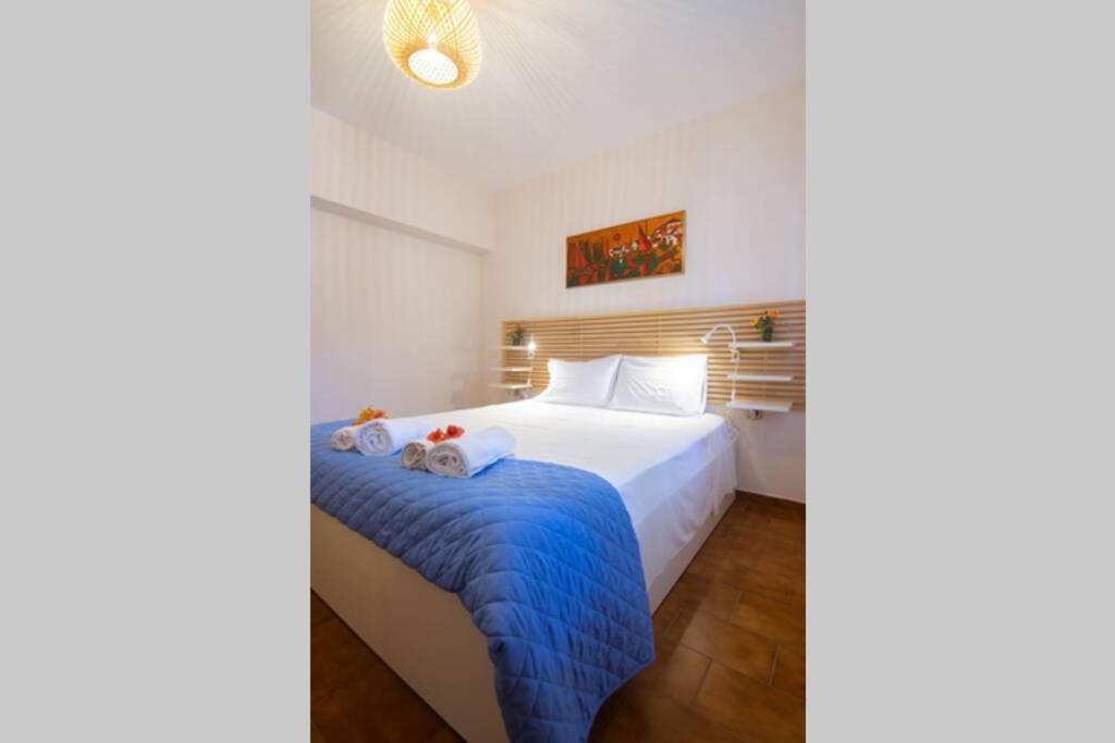 Postel nebo postele na pokoji v ubytování Natsios Thanasakis Apartment