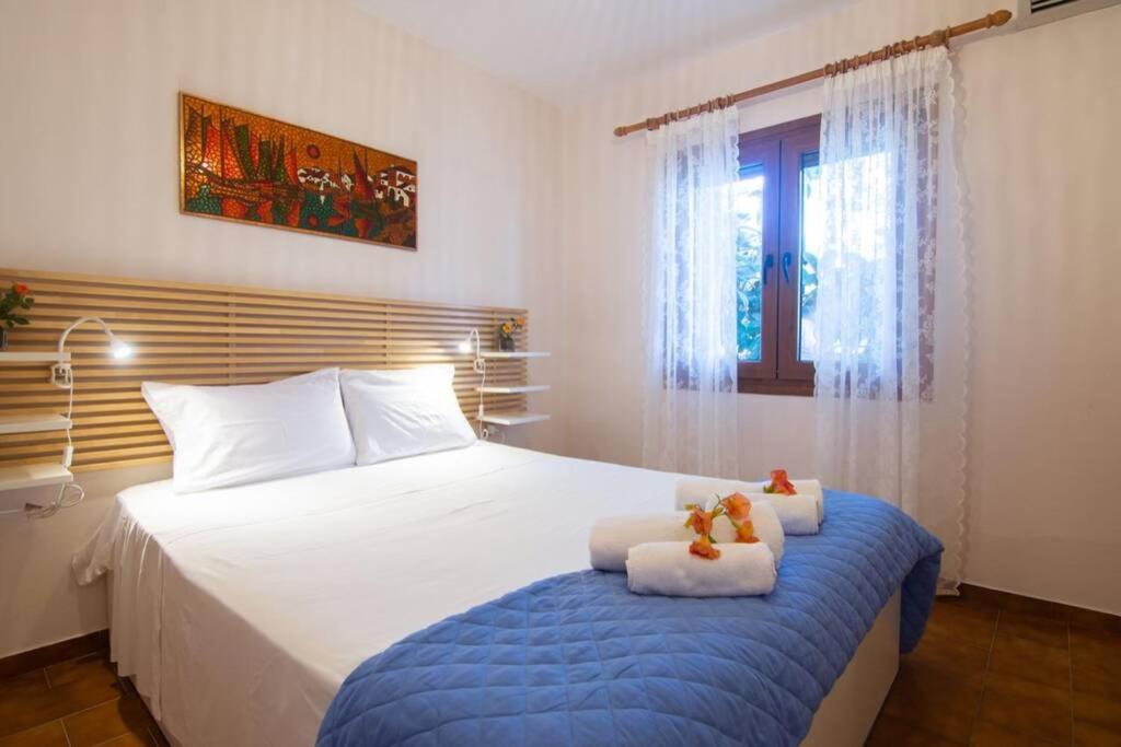 Postel nebo postele na pokoji v ubytování Natsios Thanasakis Apartment