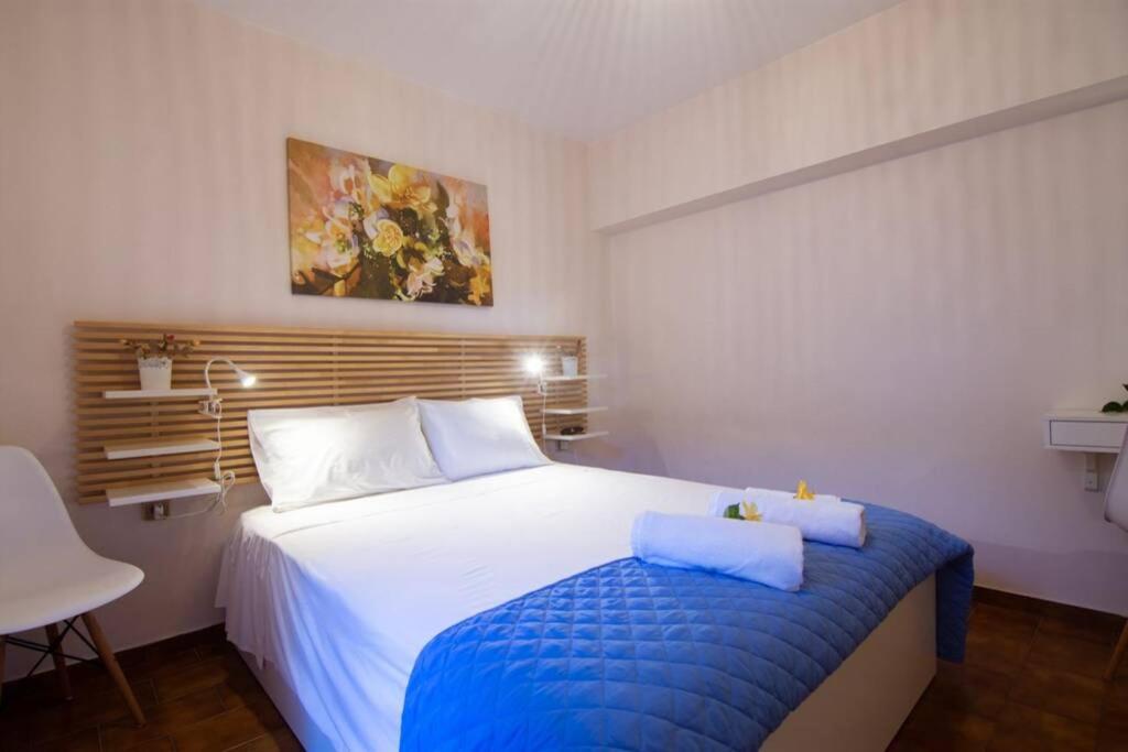 Postel nebo postele na pokoji v ubytování Natsios Thanasakis Apartment