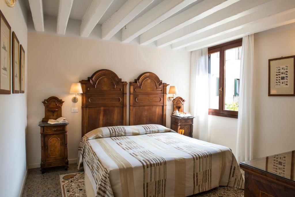 Postel nebo postele na pokoji v ubytování Hotel Agli Alboretti